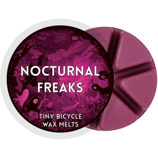 Nocturnal Freaks wax melt label with haunted magenta scene; black cherry, leather and amber home fragrance wax melts