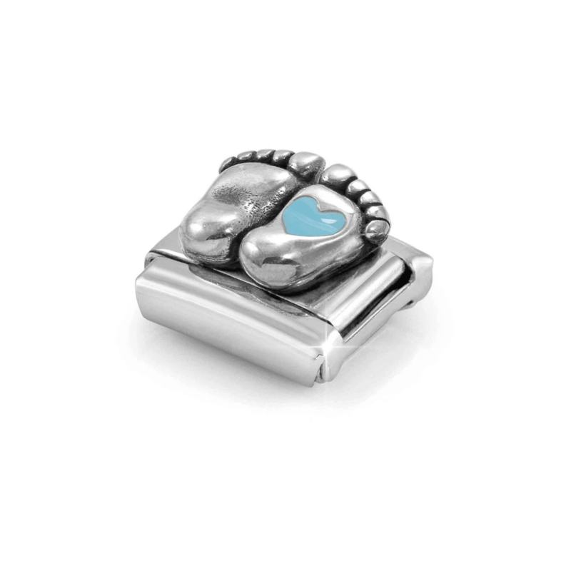 Angled view of Nomination Baby Feet Composable Link showing raised silver footprints, detailed toes and a light blue enamel heart.