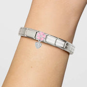 Nomination Bracelet with pink enamel flower and pavé heart pendant Classic Link shown on wrist