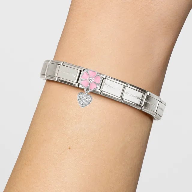 Nomination Bracelet with pink enamel flower and pavé heart pendant Classic Link shown on wrist