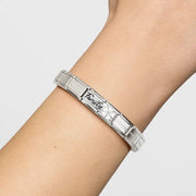 Nomination Composable bracelet on wrist with Classic Double Link engraved Family and white enamel flower with white CZ.