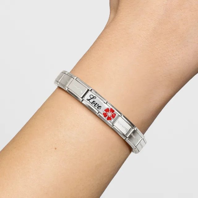 Nomination Composable bracelet on wrist with Classic Double Link engraved Love and red enamel flower with white CZ.