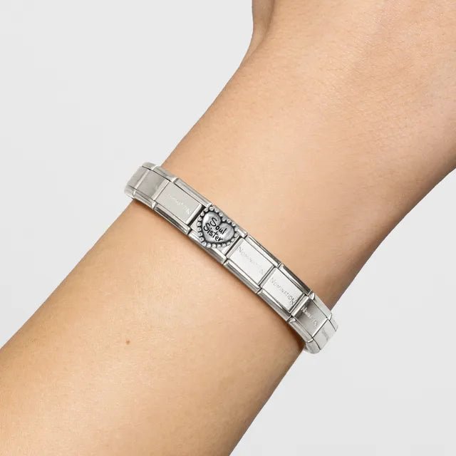 Nomination bracelet shown on wrist with Soul Sister heart link charm