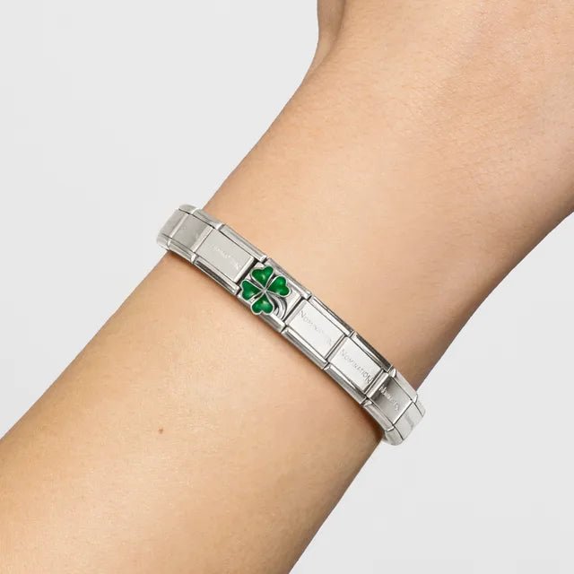 Nomination Classic Bracelet on wrist featuring the Green Clover Classic Link charm in stainless steel, silver and enamel