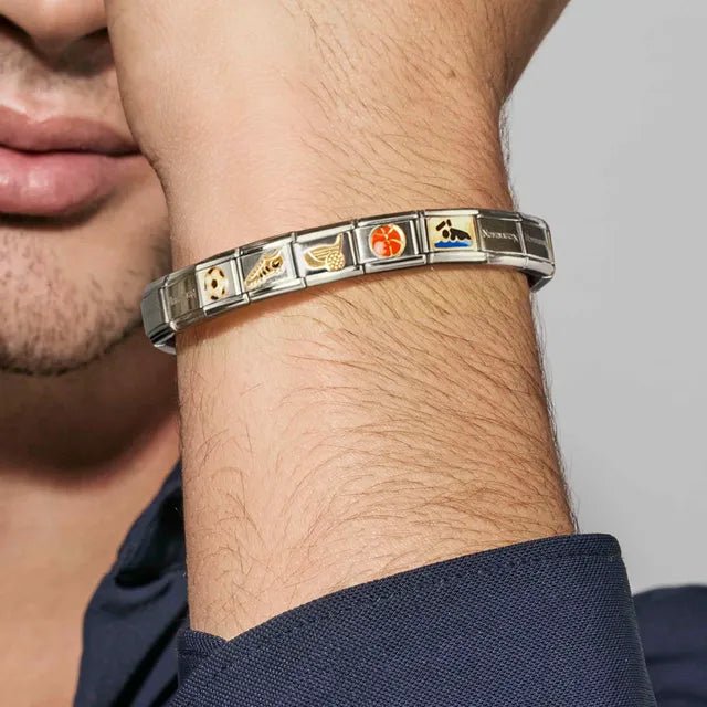 Nomination Classic Link heart with glitter enamel and bonded yellow gold, shown on a man’s wrist