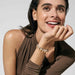 Model wearing Nomination Composable bracelet with rose-gold dangle charms