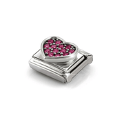 Angled view of raised silver Nomination heart charm with red cubic zirconia stones