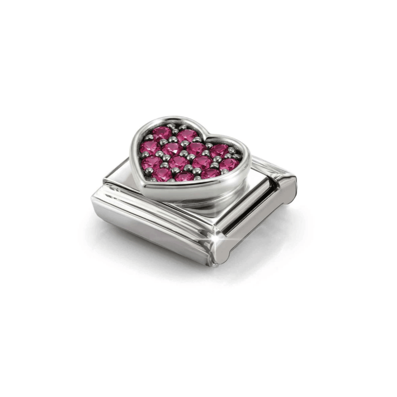 Angled view of raised silver Nomination heart charm with red cubic zirconia stones