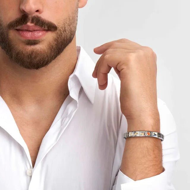 Model wearing a Nomination Composable bracelet with yellow-gold charm links