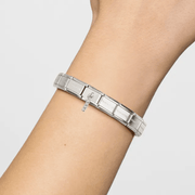 Nomination Composable Classic Letter I pendant charm worn on a stainless steel bracelet
