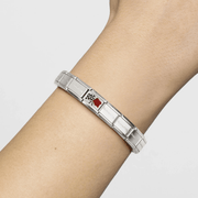 Nomination Classic Composable bracelet worn on the wrist featuring a red and black-and-white chequered racing flags charm.