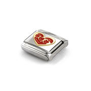 Angled close-up of Nomination Gold Hearts Within a Heart Link showing raised yellow-gold detailing and multiple red enamel hearts.