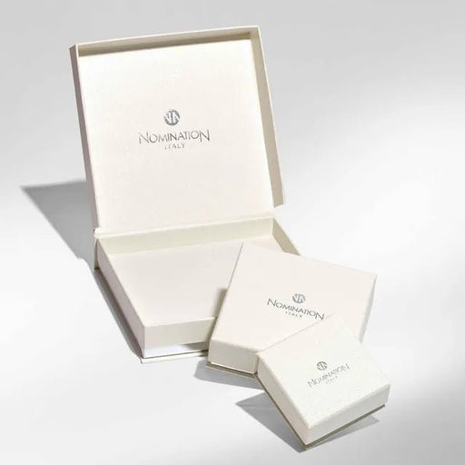 Cream Nomination Italy jewellery gift boxes in three sizes, open and closed, studio background.