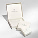 Cream Nomination Italy jewellery gift boxes in three sizes, open and closed, studio background.