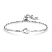 Nomination Milleluci Open Heart Bracelet in stainless steel with heart-cut white CZ and pavé bar details; adjustable slider chain on a white background.