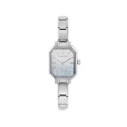 Nomination Time watch with octagonal case and light blue–silver glitter dial on stainless steel Composable strap, front view.