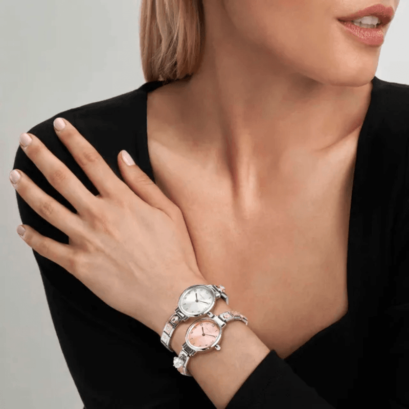 Two Nomination Paris bracelet watches styled together on a wrist