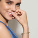 Model wearing a Nomination Pretty Bangles Yellow PVD bangle with central white Cubic Zirconia stone.