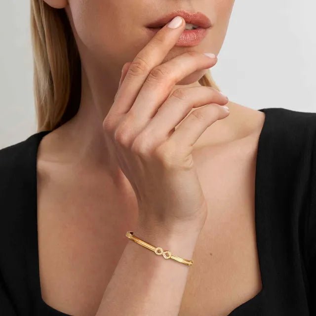 Model wearing a Nomination Pretty Bangles bracelet with an infinity Cubic Zirconia symbol.