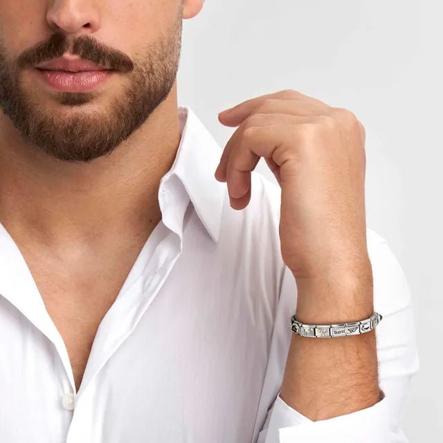 Man wearing a Nomination Classic bracelet featuring the Three Hearts double Link in sterling silver with white CZ.