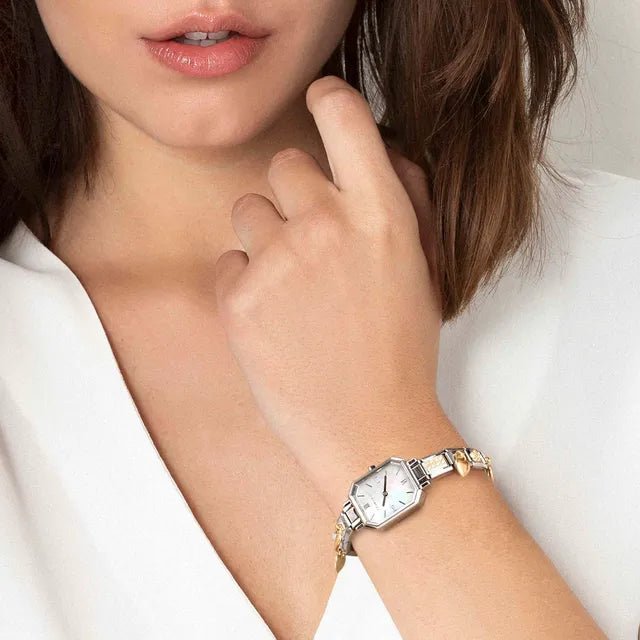 Woman wearing a Nomination Time octagonal watch on a stainless steel Composable strap.