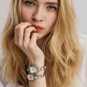 Model stacking Nomination Time watches with Composable Classic Links on the strap.