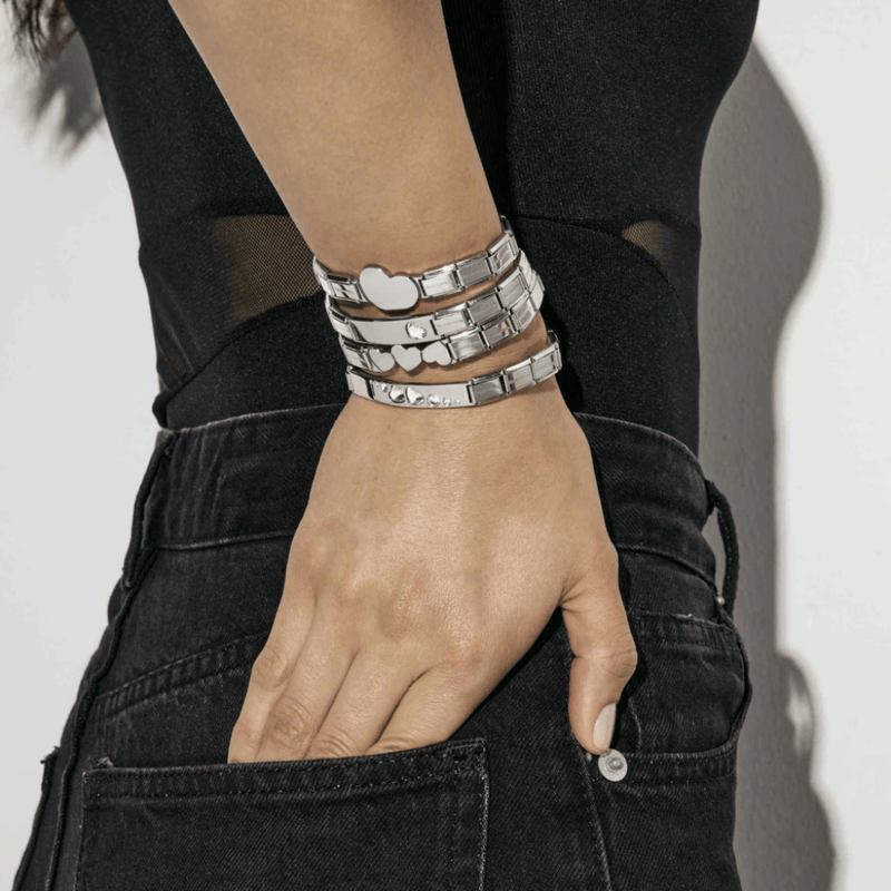 Nomination Trendsetter stainless steel bracelets layered together on the wrist