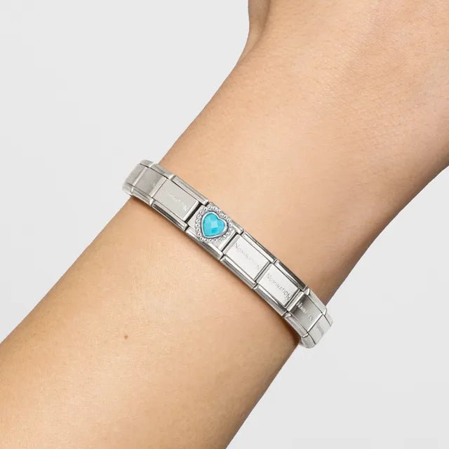 Nomination Classic Link bracelet with faceted turquoise heart charm on wrist