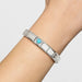 Nomination Classic Link bracelet with faceted turquoise heart charm on wrist