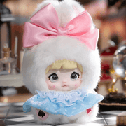 Hop in the Rabbit Hole Nommi Fairytale Town plush with a pink bow and blue collar