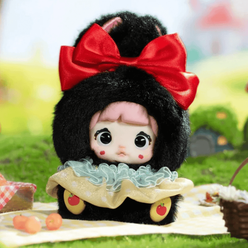Little Princess Nommi Fairytale Town plush with black hair and a large red bow
