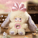 Morpheus plush – butter‑cream suit, rose‑pink bow and pearl dream core, Nommi Fantasy World.
