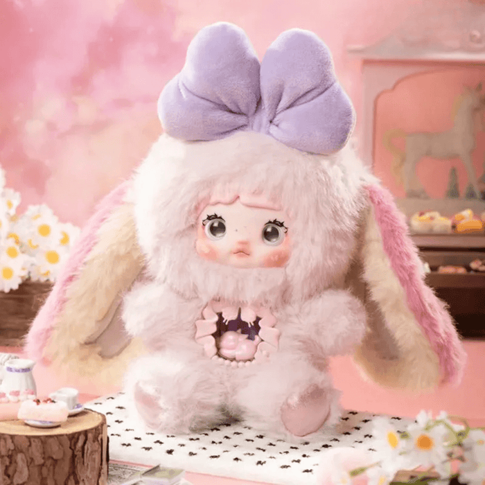 Reverie plush – candy‑floss pink suit, lavender bow and macaron core, blind box series.

