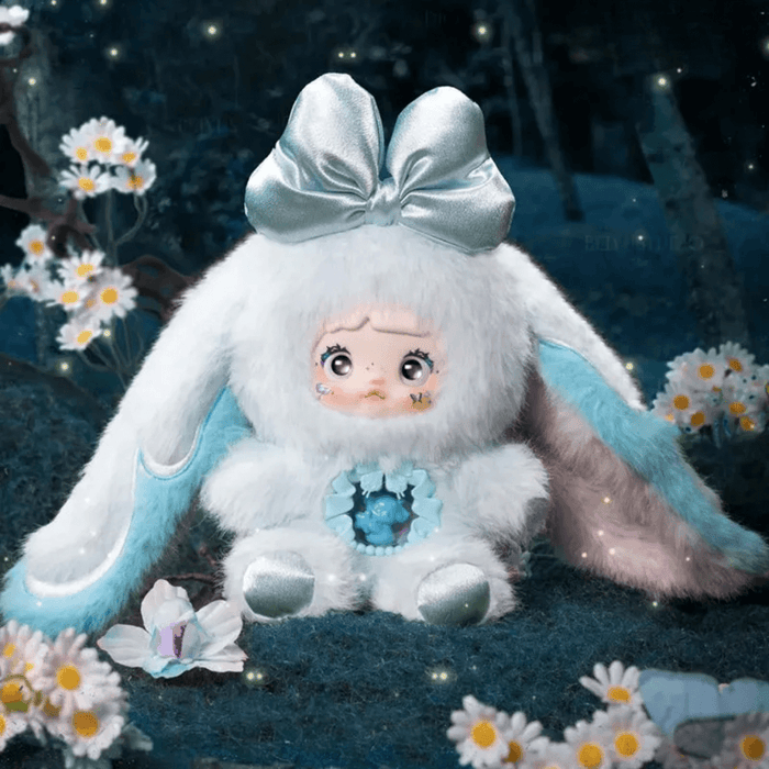 Solace plush – ice‑white suit with teal ears, silver bow and sculpted angel core.
