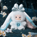 Solace plush – ice‑white suit with teal ears, silver bow and sculpted angel core.
