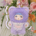 Blueberry Nommi – lavender bear suit, sky‑blue fringe and lace collar with blueberry patch.
