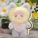 Lemon Nommi – pastel yellow kitten suit with lilac accents and stitched lemon slice emblem.
