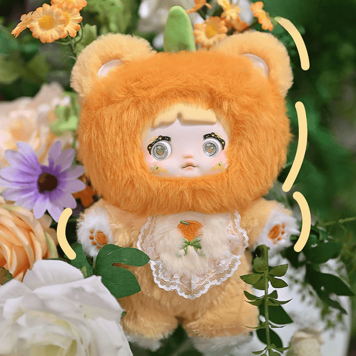 Orange Nommi – full tangerine bear suit, green leaf stem and lace bib with orange motif.
