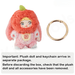 Apple Nommi plush beside separate gold keyring; text warns to remove all parts before discarding packaging.

