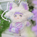 Toffee hidden Nommi – fluffy white suit with lilac ombré ears and star‑shaped purse; odds 1/72.

