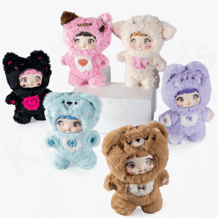 All six Nommi Loveliness plush figures posed together on white blocks, showing full color range.
