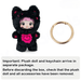 “Black Raspberry Cat Nommi plush with separate gold split‑ring keychain accessory”