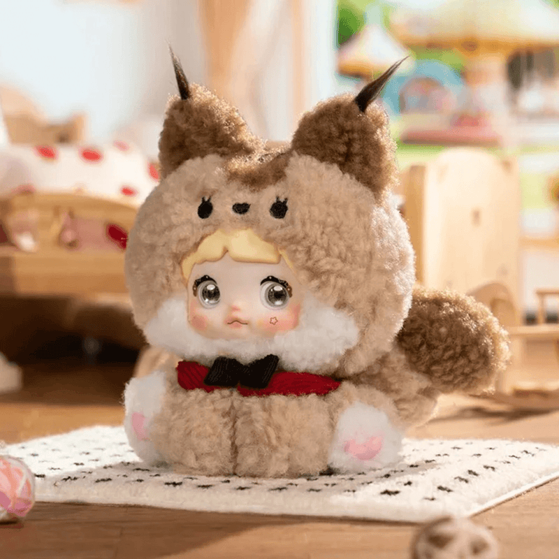 Chestnut Coco Nommi Sitting Zoo plush wearing a fluffy brown cat costume