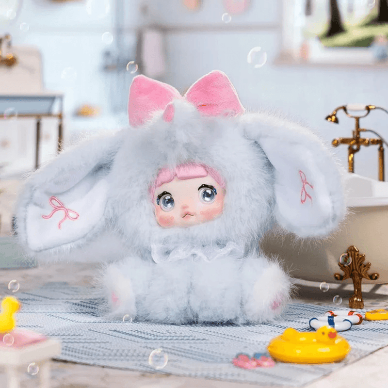 Cloudy Elephant Puff Nommi plush in a soft blue animal costume with large ears