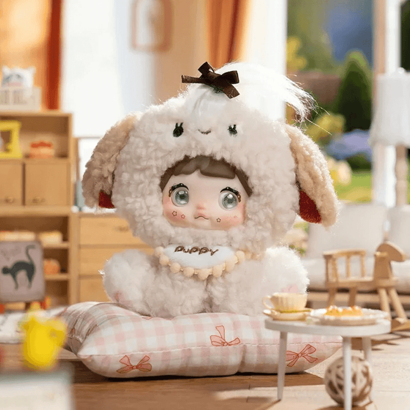Latte Woof-Woof Nommi Sitting Zoo plush in a cream puppy costume