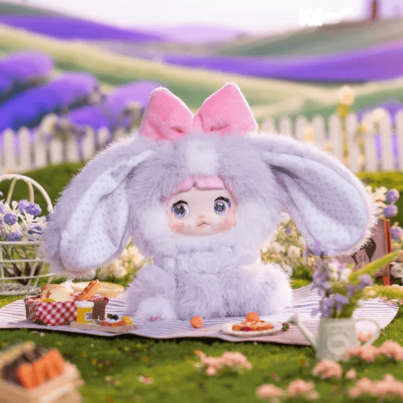 Taro Paste Bunny Nommi Sitting Zoo plush in a fluffy lavender bunny costume