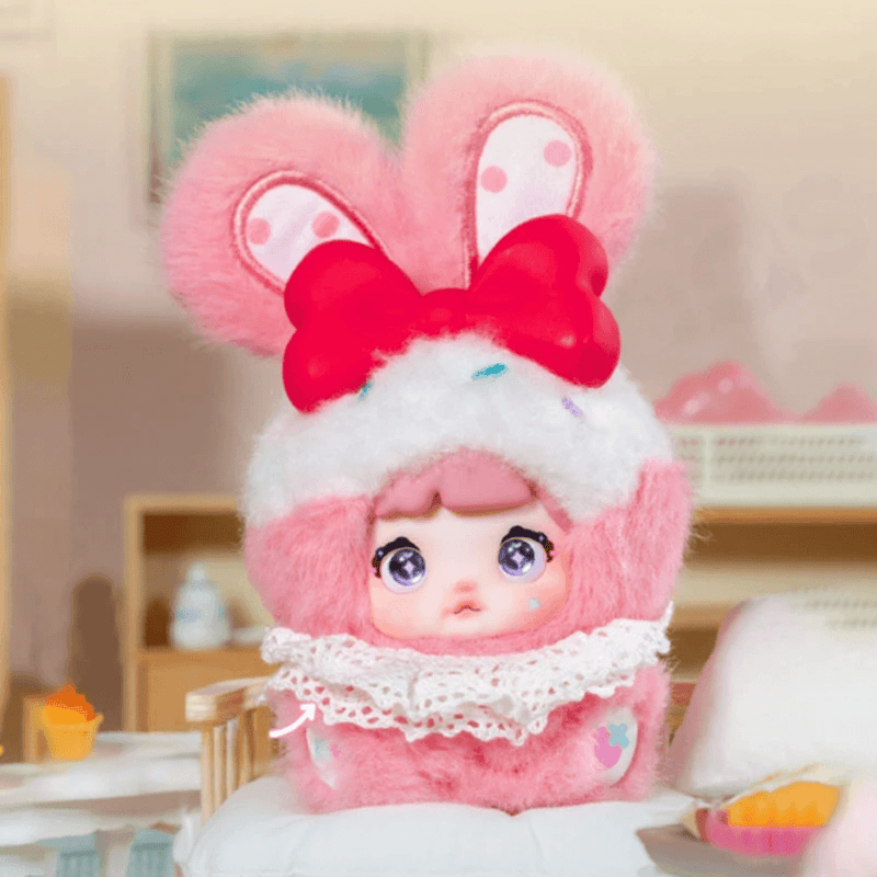 Strawberry Cream Nommi Sweetheart Bunny plush in pink with a large red bow