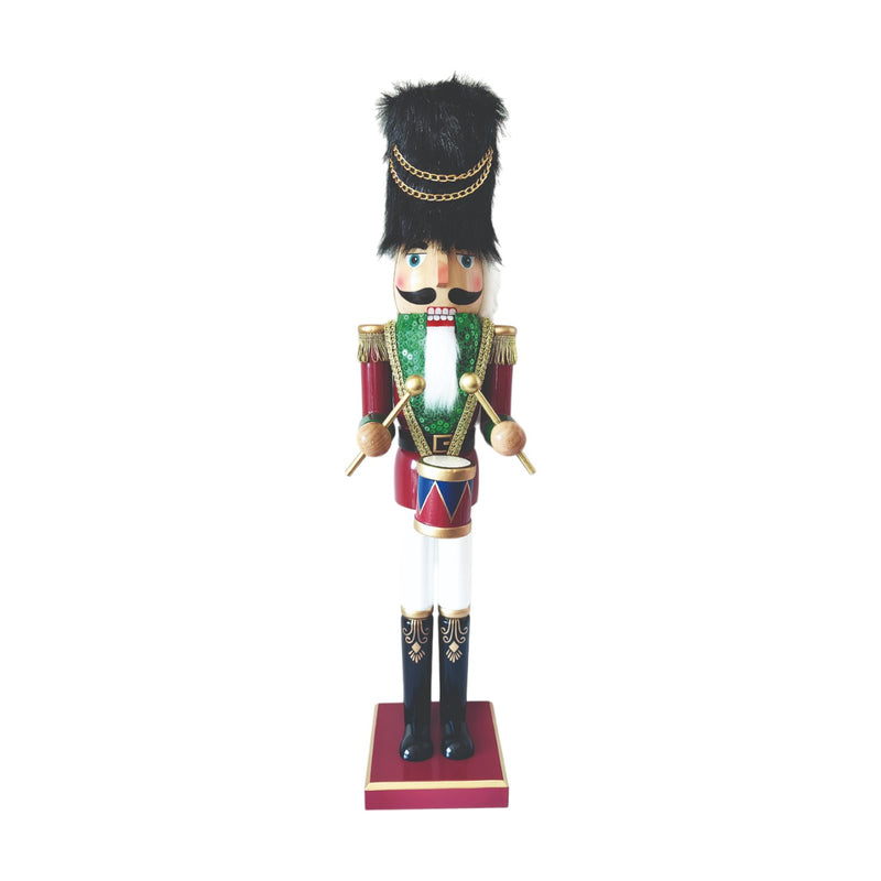60cm nutcracker drummer with green waistcoat and black hat on red base.

