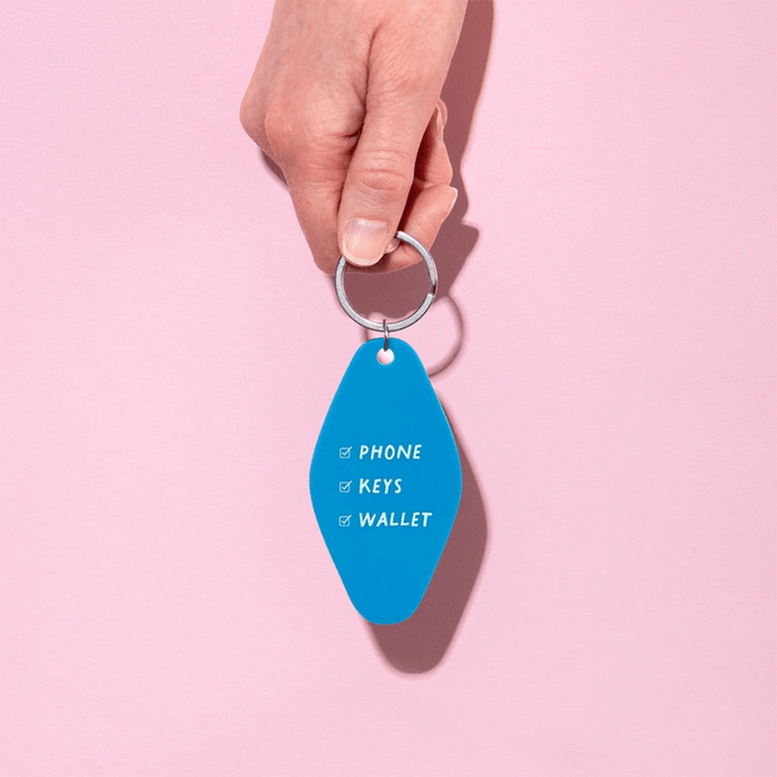 Ohh Deer Phone Keys Wallet keyring being held against a pink background