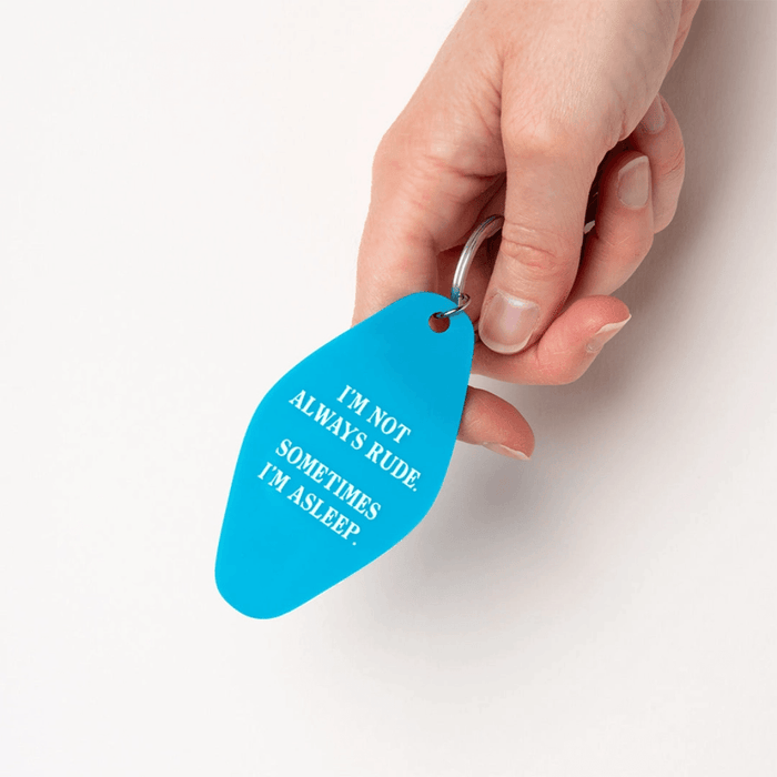 Ohh Deer Sometimes I’m Asleep keyring being held against a white background